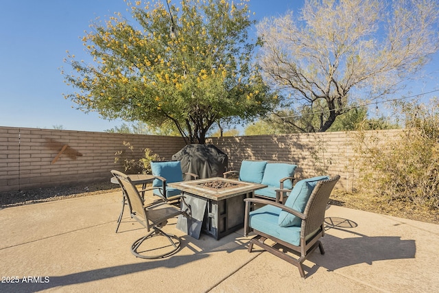 view of patio / terrace with an outdoor fire pit