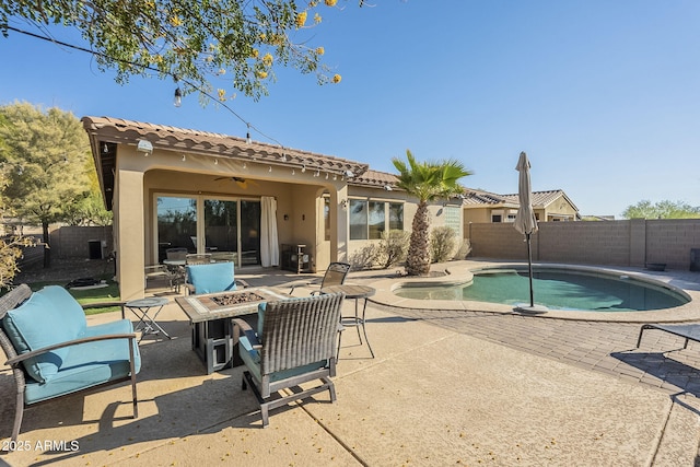 view of pool with a patio area, an outdoor fire pit, and ceiling fan