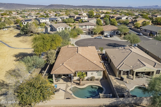 birds eye view of property featuring a mountain view