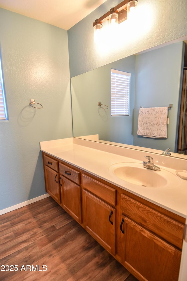 bathroom featuring vanity and wood-type flooring