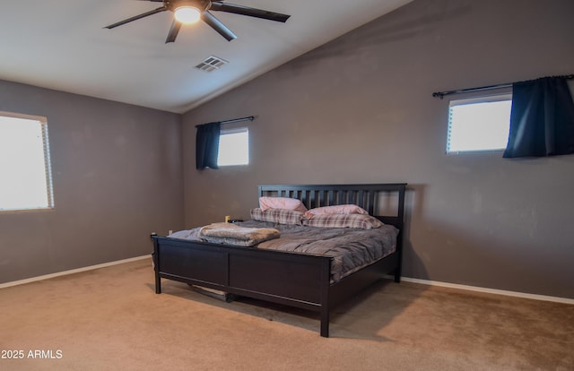 carpeted bedroom featuring vaulted ceiling and ceiling fan