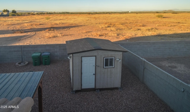 view of outbuilding featuring a rural view