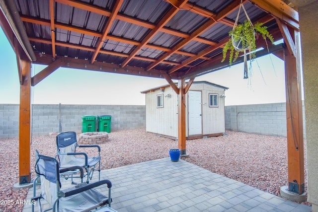 view of patio / terrace with a shed