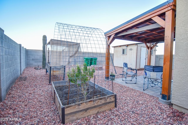 exterior space featuring a storage unit and a patio area