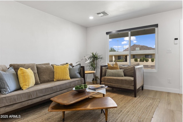 6723 E 1st Ave, Scottsdale, AZ 85251 - living room featuring baseboards, light wood finished floors, and recessed lighting