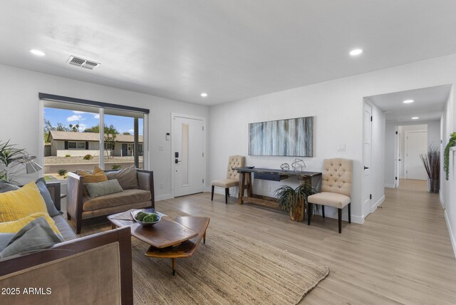 6723 E 1st Ave, Scottsdale, AZ 85251 - living room featuring light wood-style floors, recessed lighting, and baseboards