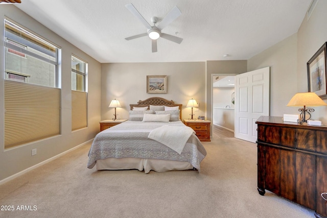 carpeted bedroom featuring ceiling fan and baseboards