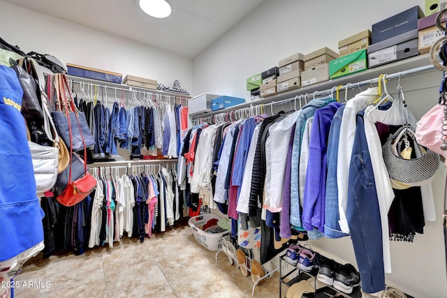 spacious closet with tile patterned flooring