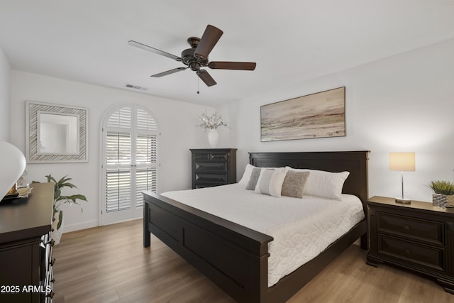 bedroom featuring ceiling fan and light hardwood / wood-style floors