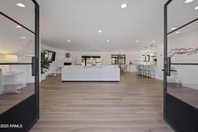 living room with light hardwood / wood-style floors