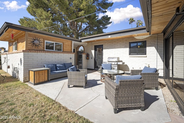 view of patio / terrace with an outdoor living space and a grill