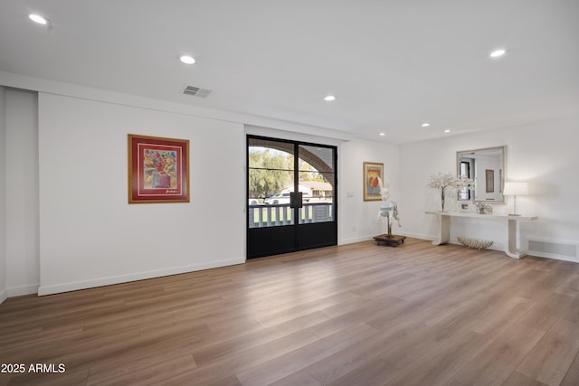 unfurnished living room featuring light wood-type flooring