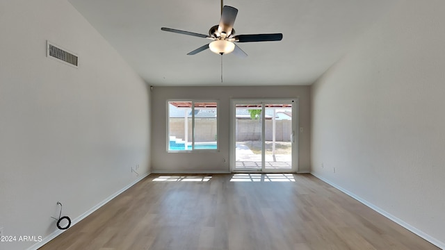 spare room featuring ceiling fan and light hardwood / wood-style flooring