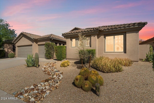 15120 E Vermillion Dr, Fountain Hills, AZ 85268 - view of front facade featuring a garage, stucco siding, driveway, and a tile roof