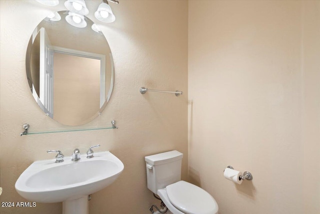 bathroom with toilet and sink