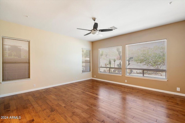 unfurnished room featuring ceiling fan and hardwood / wood-style floors