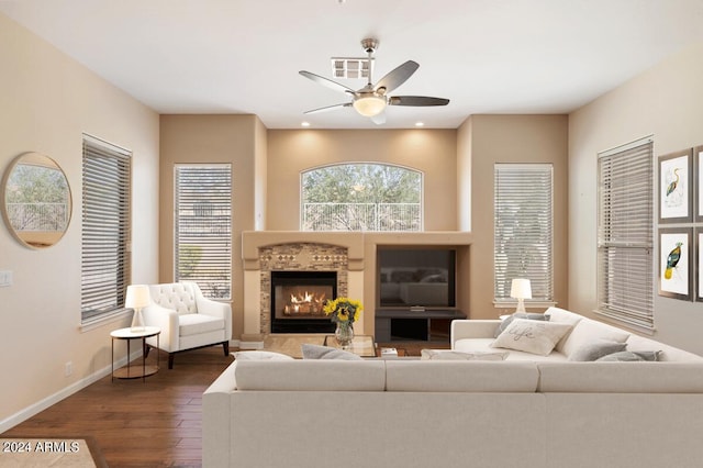 15120 E Vermillion Dr, Fountain Hills, AZ 85268 - living room featuring a ceiling fan, dark wood-style flooring, visible vents, a tile fireplace, and baseboards