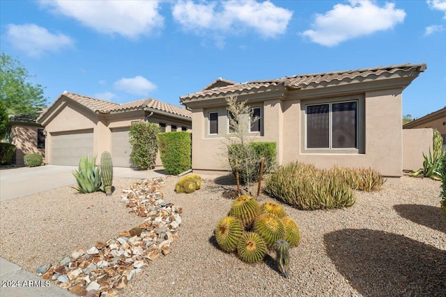 15120 E Vermillion Dr, Fountain Hills, AZ 85268 - mediterranean / spanish house with concrete driveway, a garage, a tile roof, and stucco siding