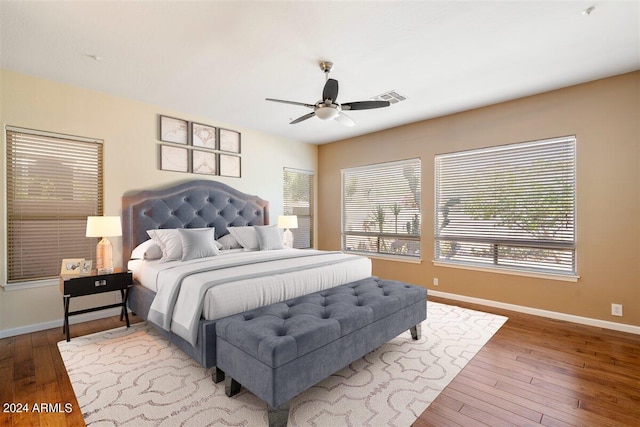 bedroom with ceiling fan and hardwood / wood-style floors