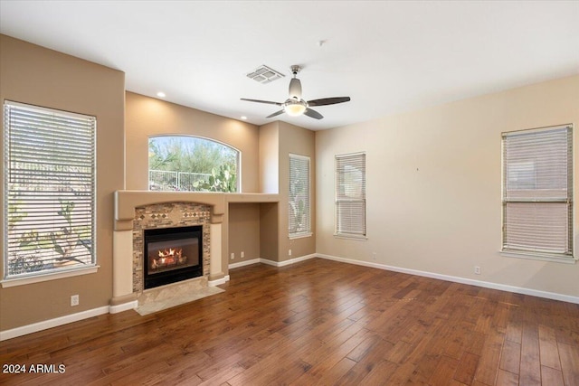 15120 E Vermillion Dr, Fountain Hills, AZ 85268 - unfurnished living room featuring visible vents, a fireplace, baseboards, ceiling fan, and hardwood / wood-style flooring