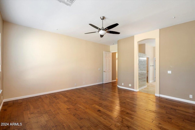 unfurnished room featuring ceiling fan and dark hardwood / wood-style floors