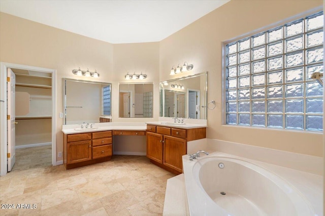 bathroom featuring vanity and a bathtub