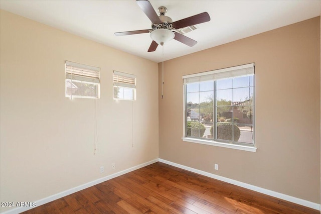 15120 E Vermillion Dr, Fountain Hills, AZ 85268 - unfurnished room with baseboards, visible vents, ceiling fan, and hardwood / wood-style floors