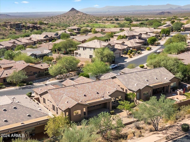 birds eye view of property with a mountain view