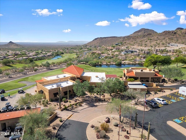 bird's eye view with a water and mountain view