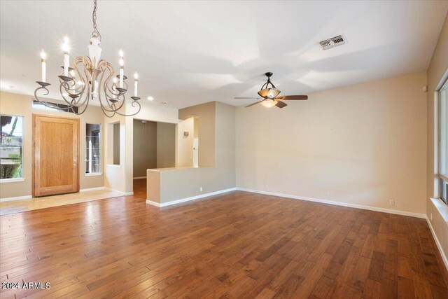 15120 E Vermillion Dr, Fountain Hills, AZ 85268 - empty room featuring baseboards, visible vents, hardwood / wood-style flooring, and ceiling fan with notable chandelier