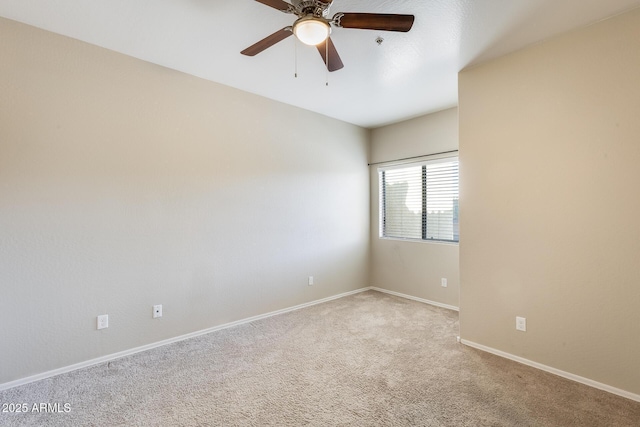 unfurnished room with ceiling fan and light colored carpet