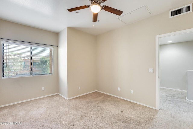 unfurnished room with ceiling fan and light colored carpet