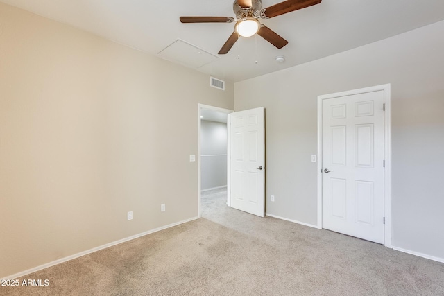 unfurnished bedroom featuring light carpet and ceiling fan