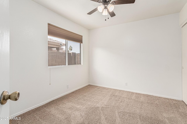 carpeted empty room with ceiling fan