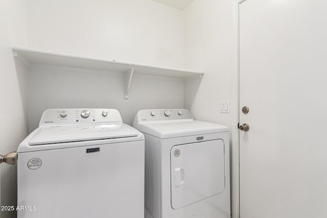 laundry area with separate washer and dryer