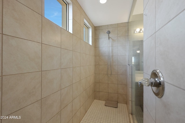 bathroom with tiled shower