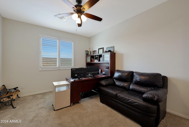 office space with light carpet and ceiling fan