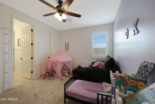 carpeted bedroom with ceiling fan