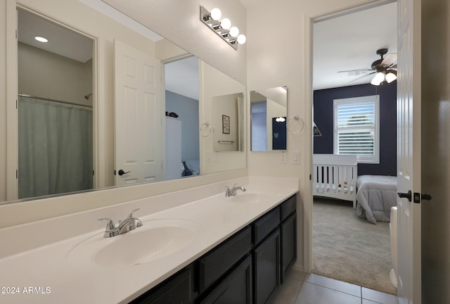 bathroom with tile patterned floors, ceiling fan, and vanity