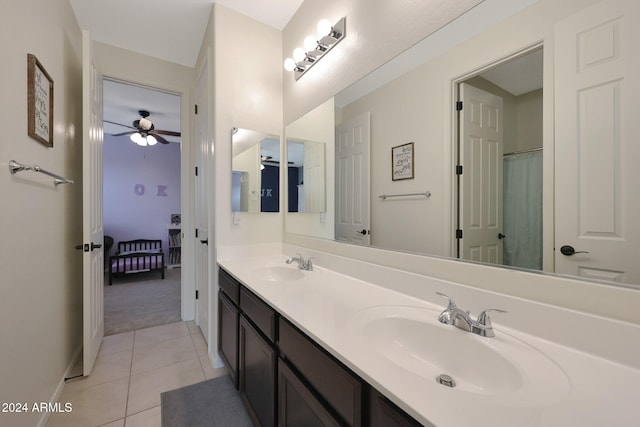 bathroom with tile patterned flooring, ceiling fan, and vanity