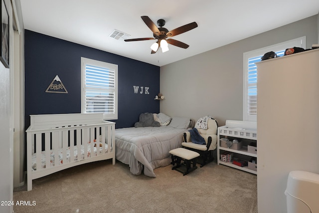 carpeted bedroom with ceiling fan