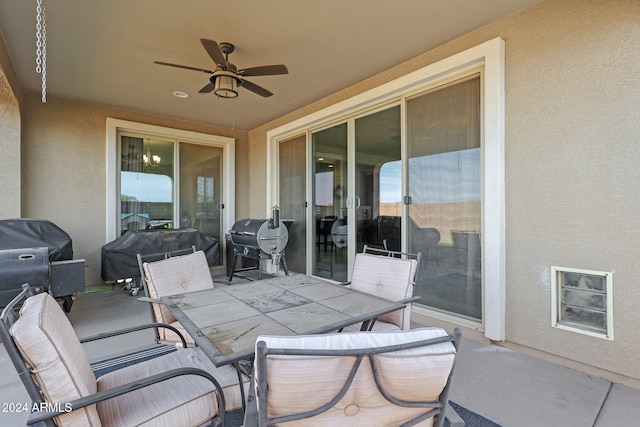 view of patio with ceiling fan and grilling area