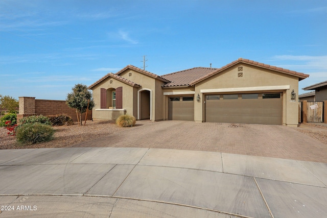 mediterranean / spanish-style house featuring a garage