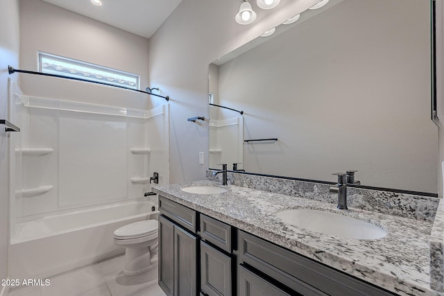 full bathroom with shower / tub combination, vanity, toilet, and tile patterned floors