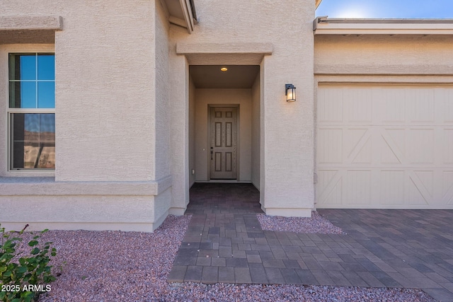 property entrance with a garage