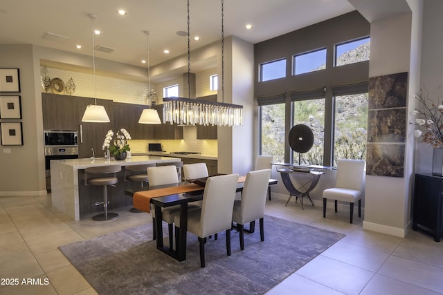 dining area featuring light tile patterned floors