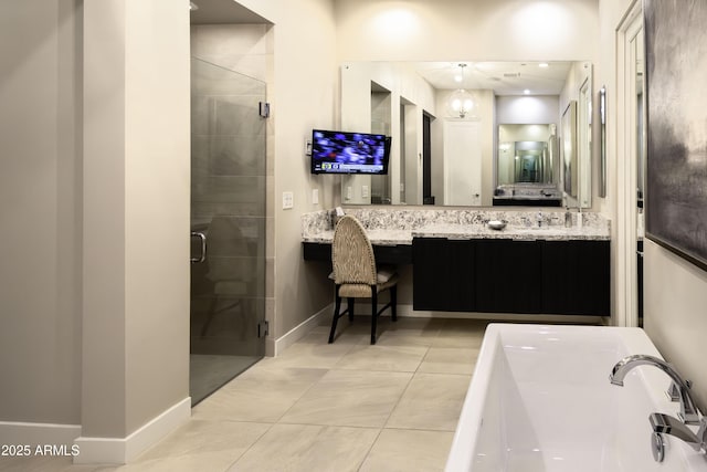 bathroom with tile patterned floors, plus walk in shower, a chandelier, and vanity