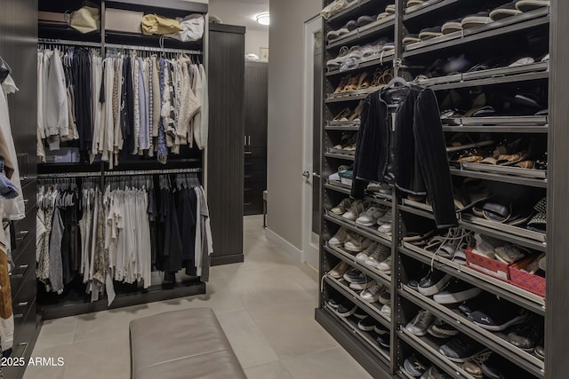 walk in closet featuring tile patterned floors