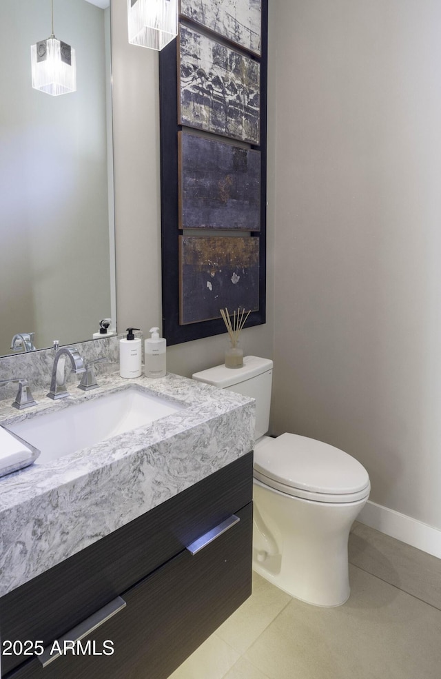 bathroom with vanity, tile patterned floors, and toilet