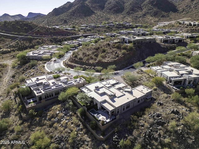 birds eye view of property with a mountain view